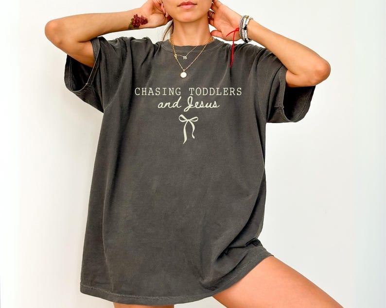 The "Chasing Toddlers & Jesus" Everyday Tee -  Christian Mom Shirt with Coquette Bow Detail